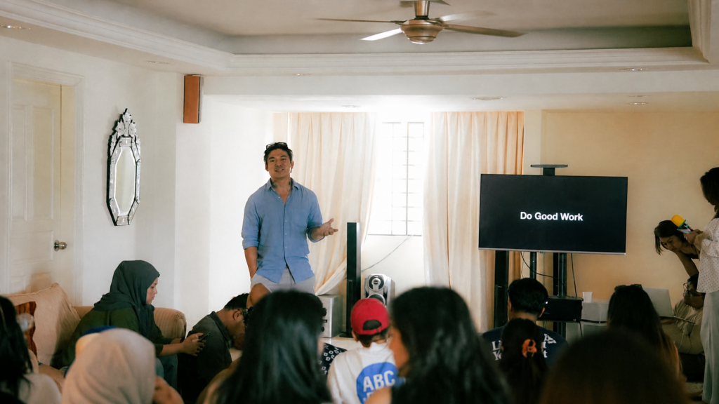 Founder, Loke leading a company off-site training session with a team in a collaborative workshop environment.